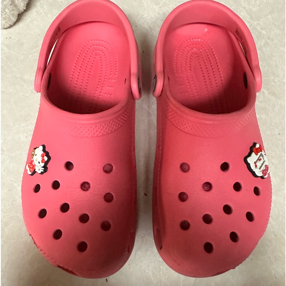 Crocs size women’s 8 hot pink with two hello kitty charms